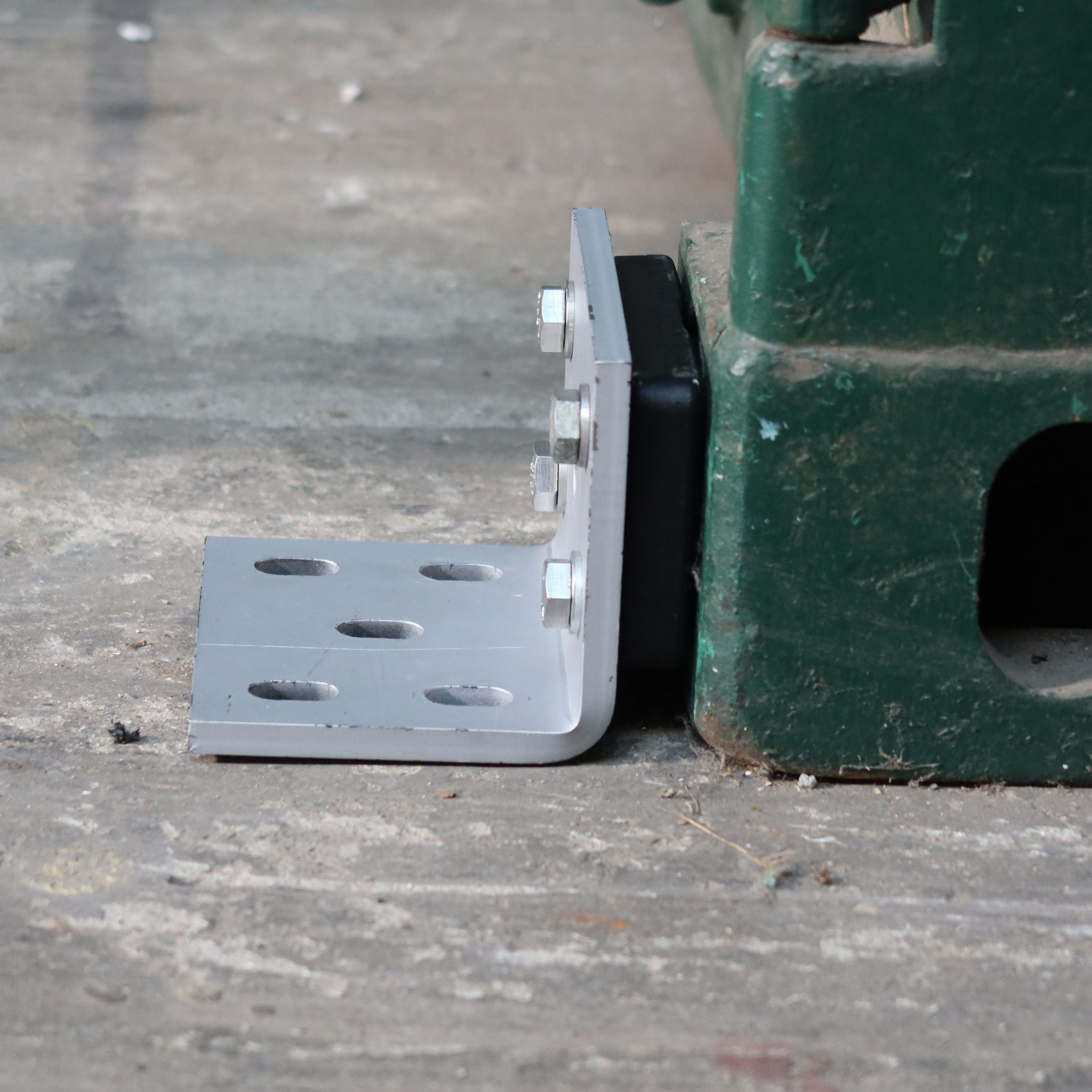 Shipping Container Bracket to secure the container to the floor