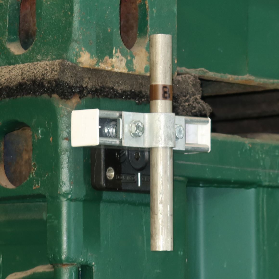 Attach almost anything to shipping containers. | Domino Clamps