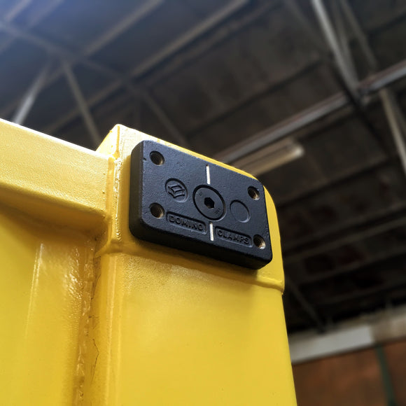Domino Clamp attached to the corner of a shipping container